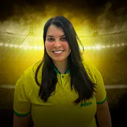 a woman in a yellow shirt standing in front of a stadium
